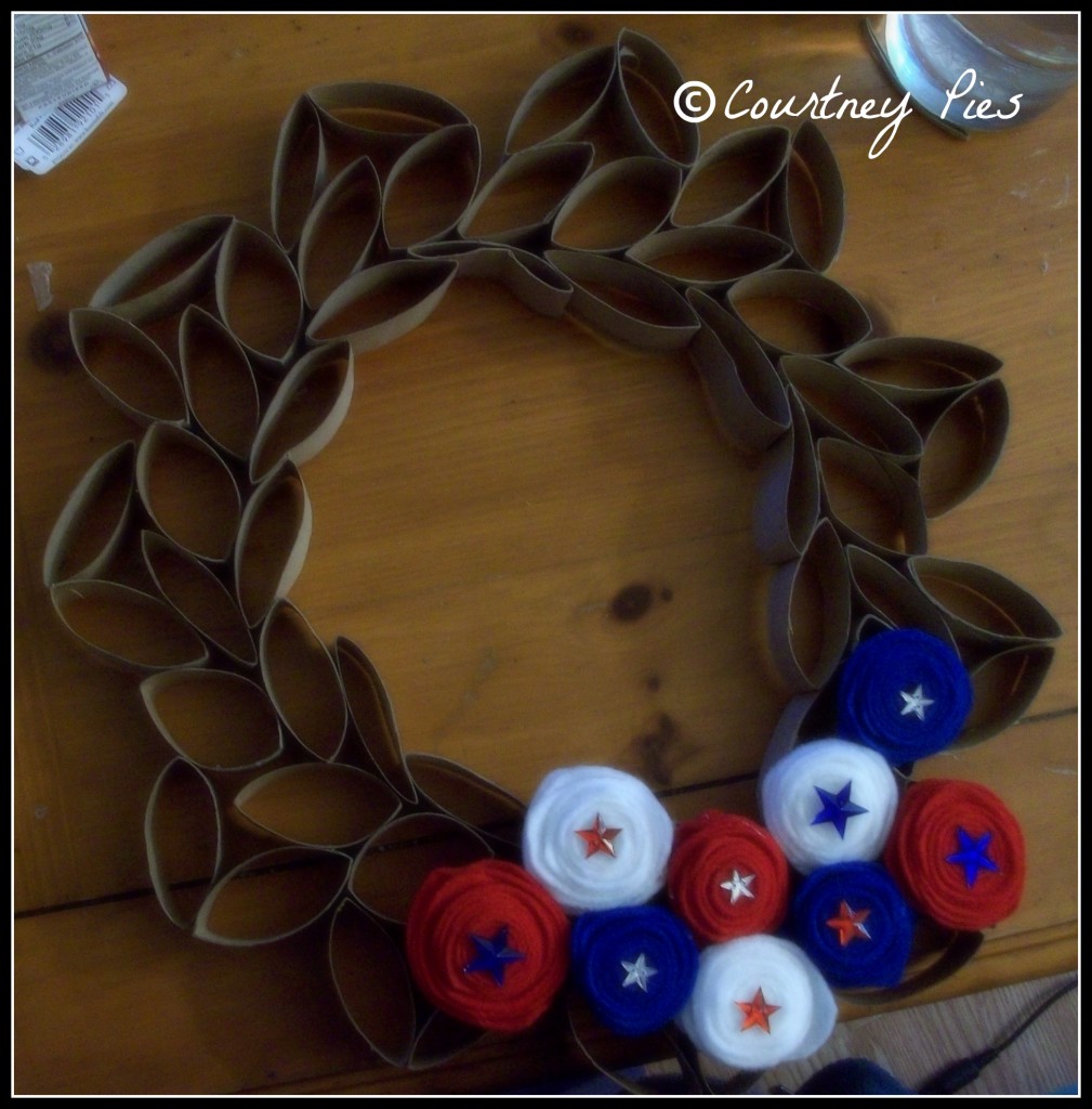 toilet paper roll wreath on table 