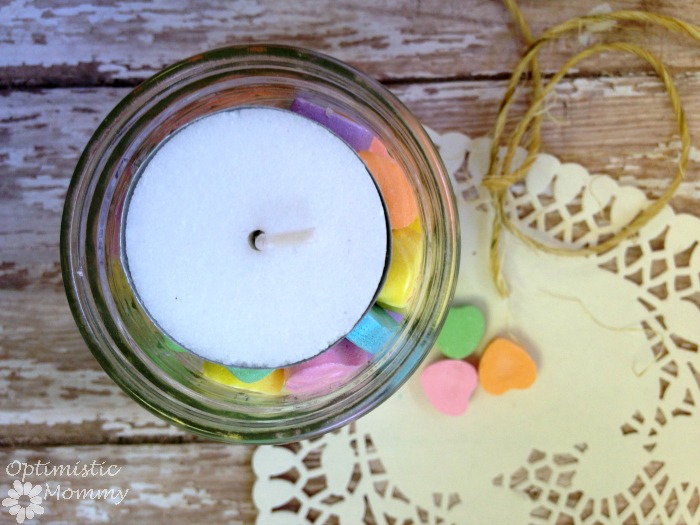 Do you love conversation hearts? They seem to reflect the Valentine's Day season quite well! This season, why not work a few into your crafting? Here is how you can create a Valentine's Day conversation hearts votive holder, perfect for displaying amongst your décor or for gift giving. | Optimistic Mommy