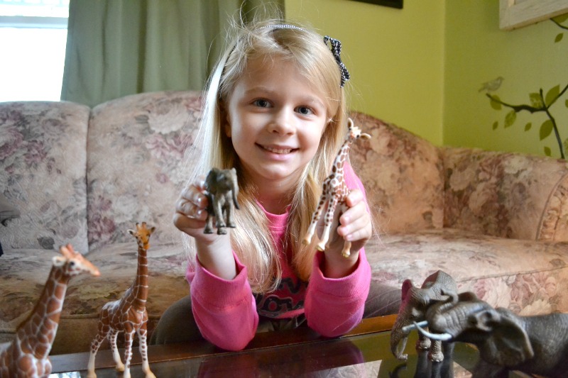 Riley With Schleich African Elephants and Giraffes