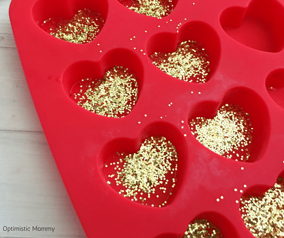 Make our DIY Valentine Hearts Glitter Crayons as a fun and easy craft kids will love helping you make to give to their friends this year! Valentine Craft ideas like this are perfect for little ones!