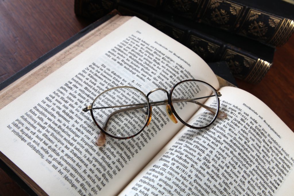 Glasses on an antique book