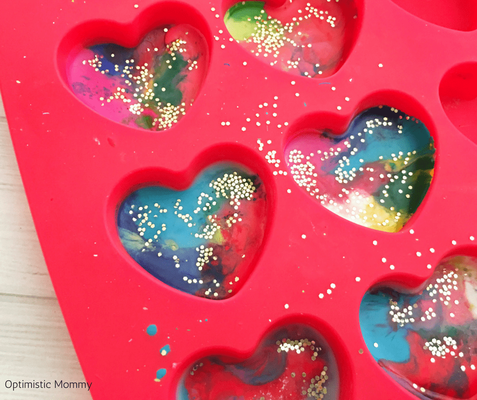 Make our DIY Valentine Hearts Glitter Crayons as a fun and easy craft kids will love helping you make to give to their friends this year! Valentine Craft ideas like this are perfect for little ones!