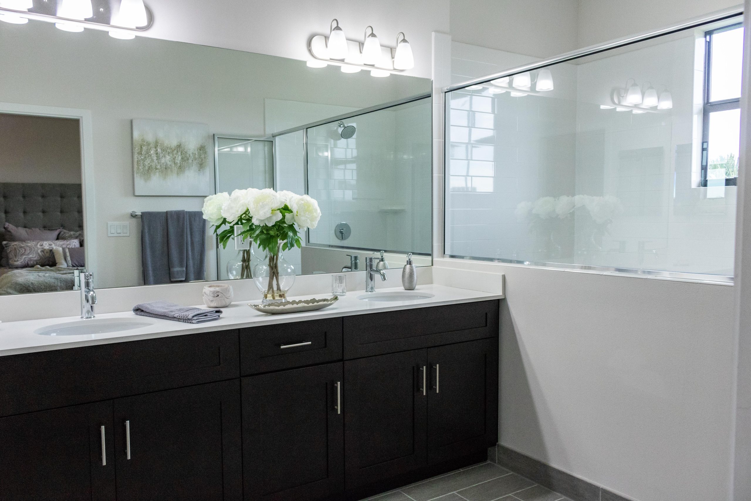 A beautiful bathroom with a countertop and lightings.
