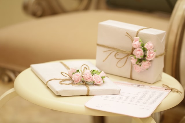 Two beautifully wrapped gifts placed on the table.