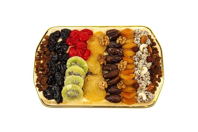 Mixed assorted quality nuts and dry fruits placed in a plate.