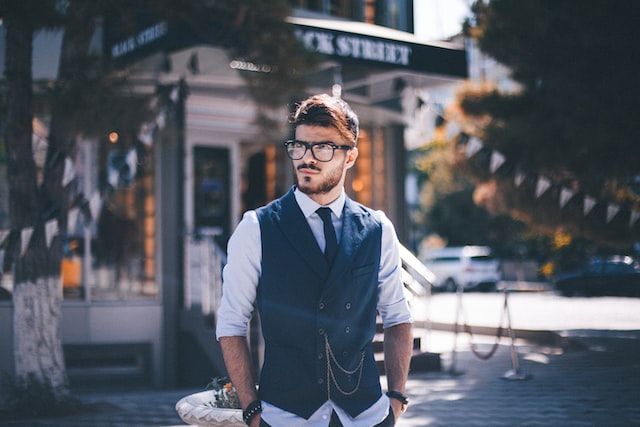 Man posing in stylish glasses.