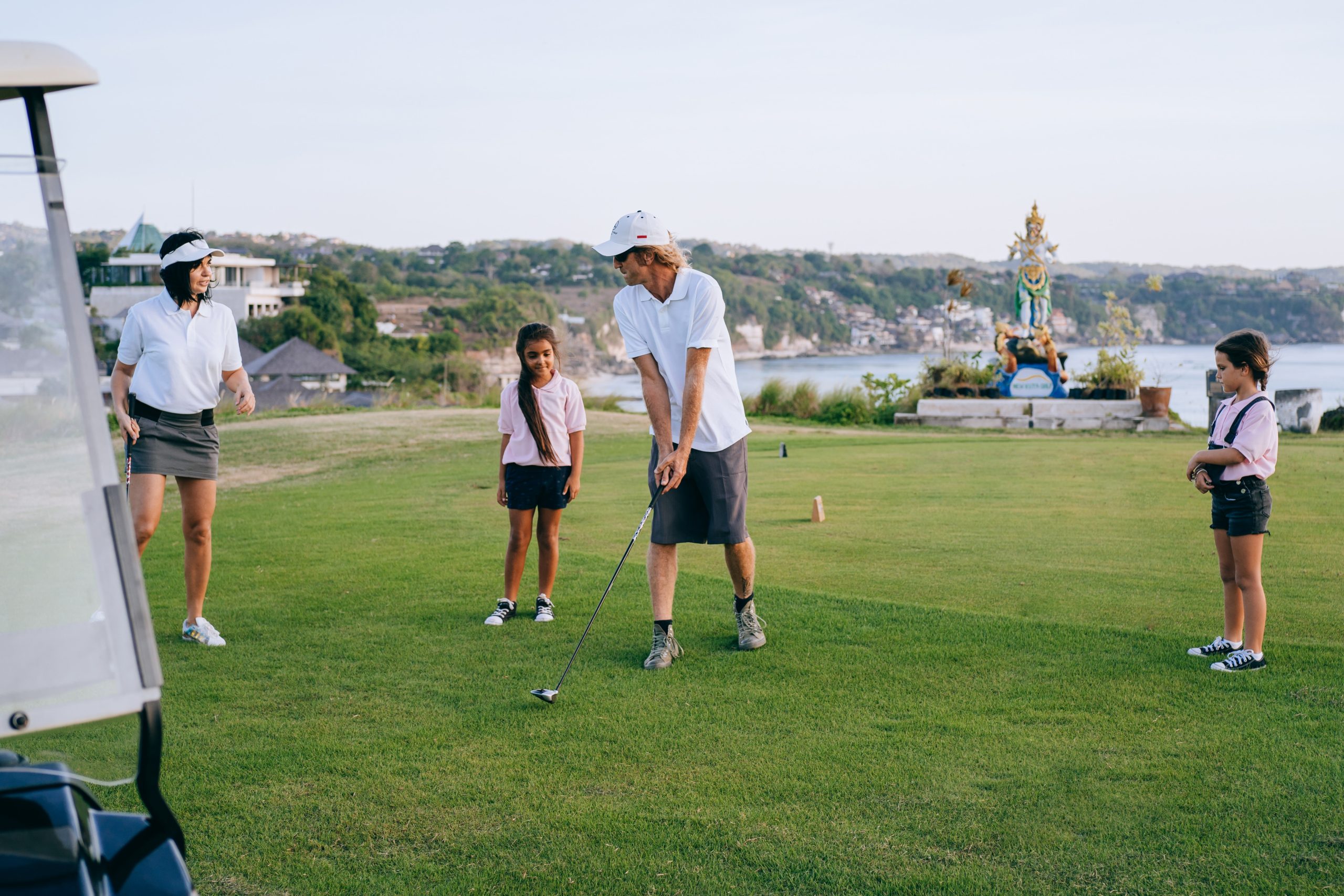 A family playing golf together.
