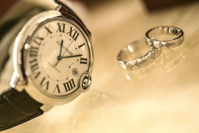 A cartier watch with two band rings.