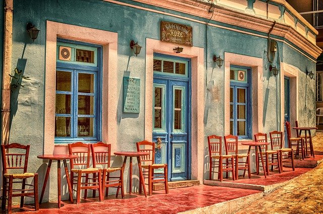 A cafe with chairs placed outside.