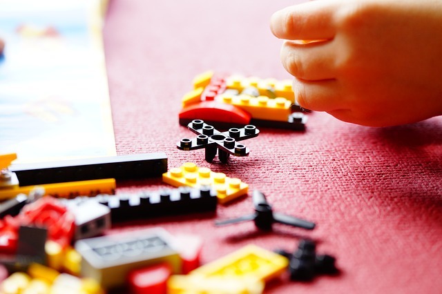 A child playing with Lego.