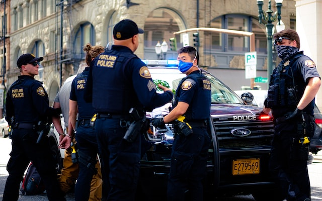 Cops arresting a man.