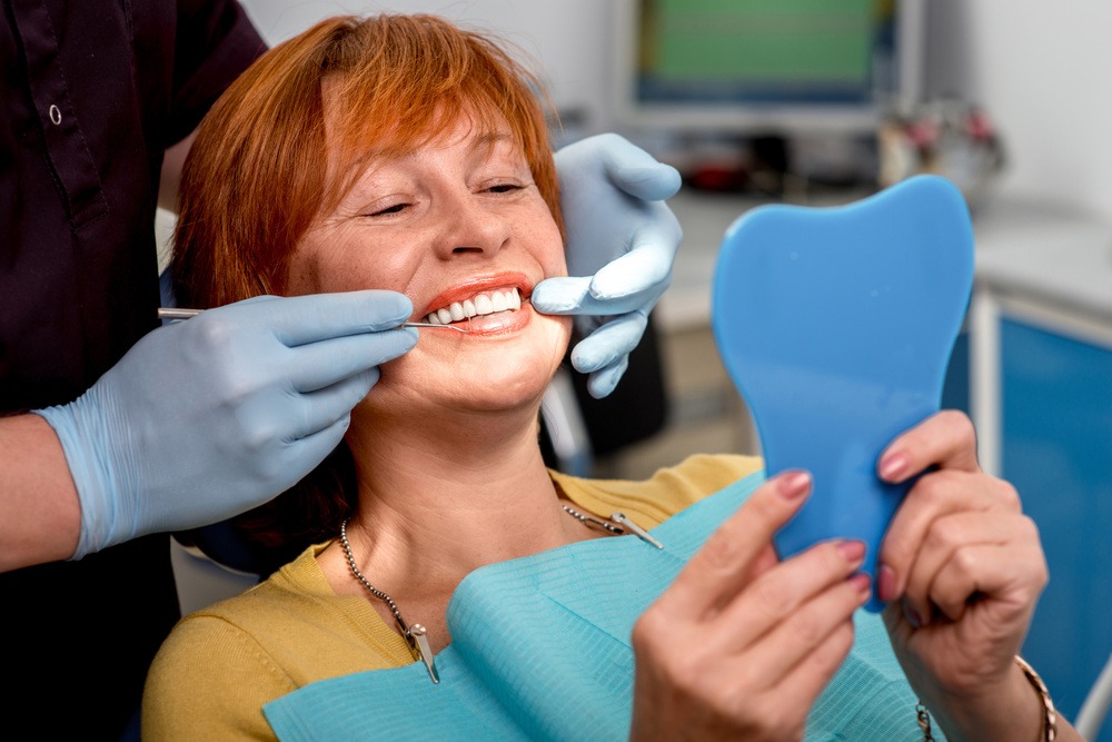 A woman wearing Dentures.