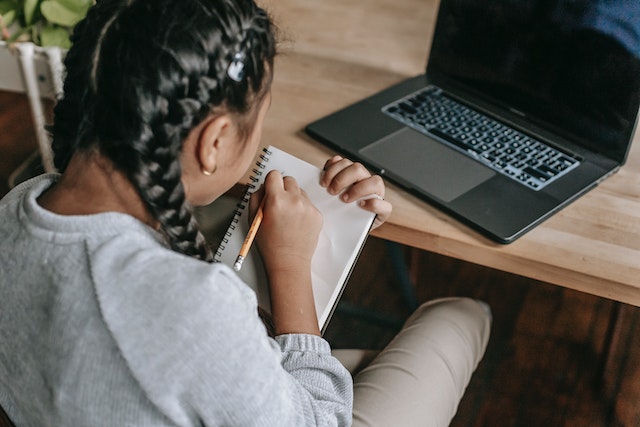 A girl writing an essay.