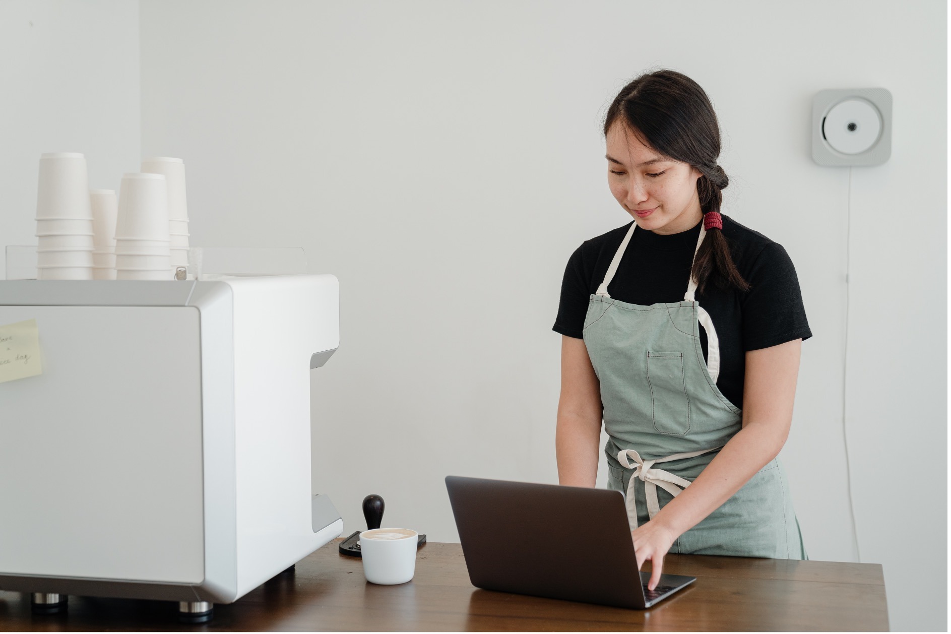 Woman working on laptop.