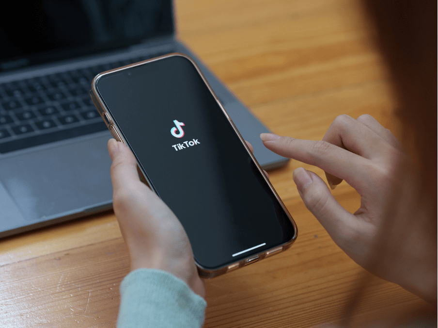 A woman working on Tiktok.