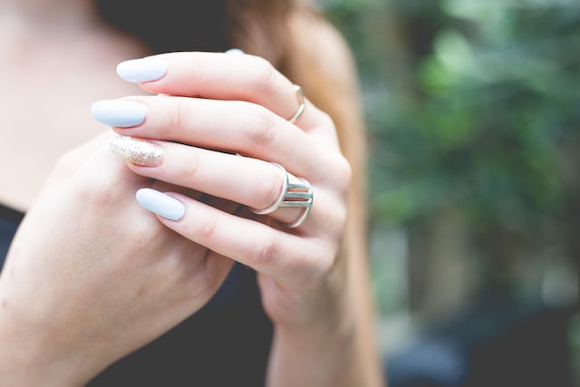 A woman with long beautiful nails.