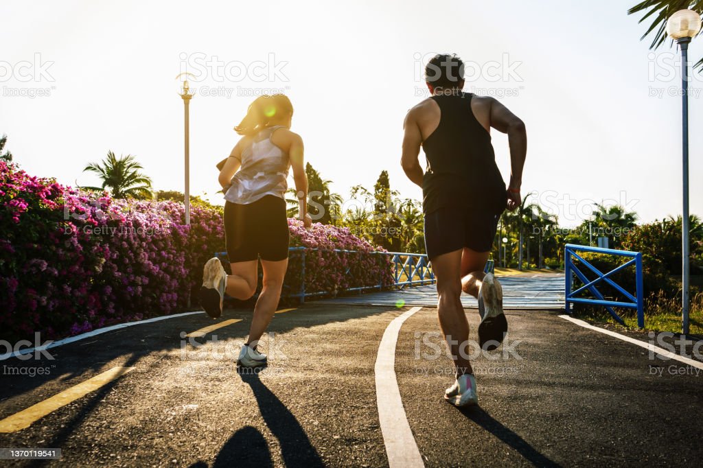 A man and woman running.