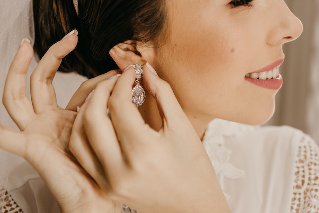 A woman wearing jewelry.