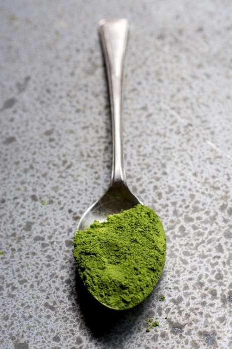 Spoon of green powder