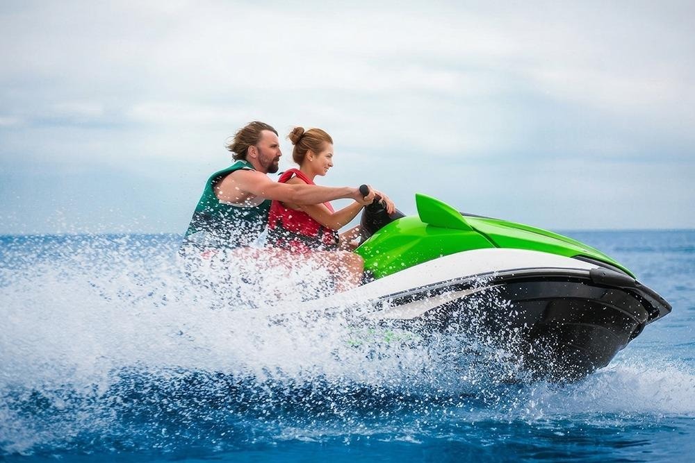Adventure seekers enjoying a guided jetski tour through the turquoise waters of the Whitsundays.